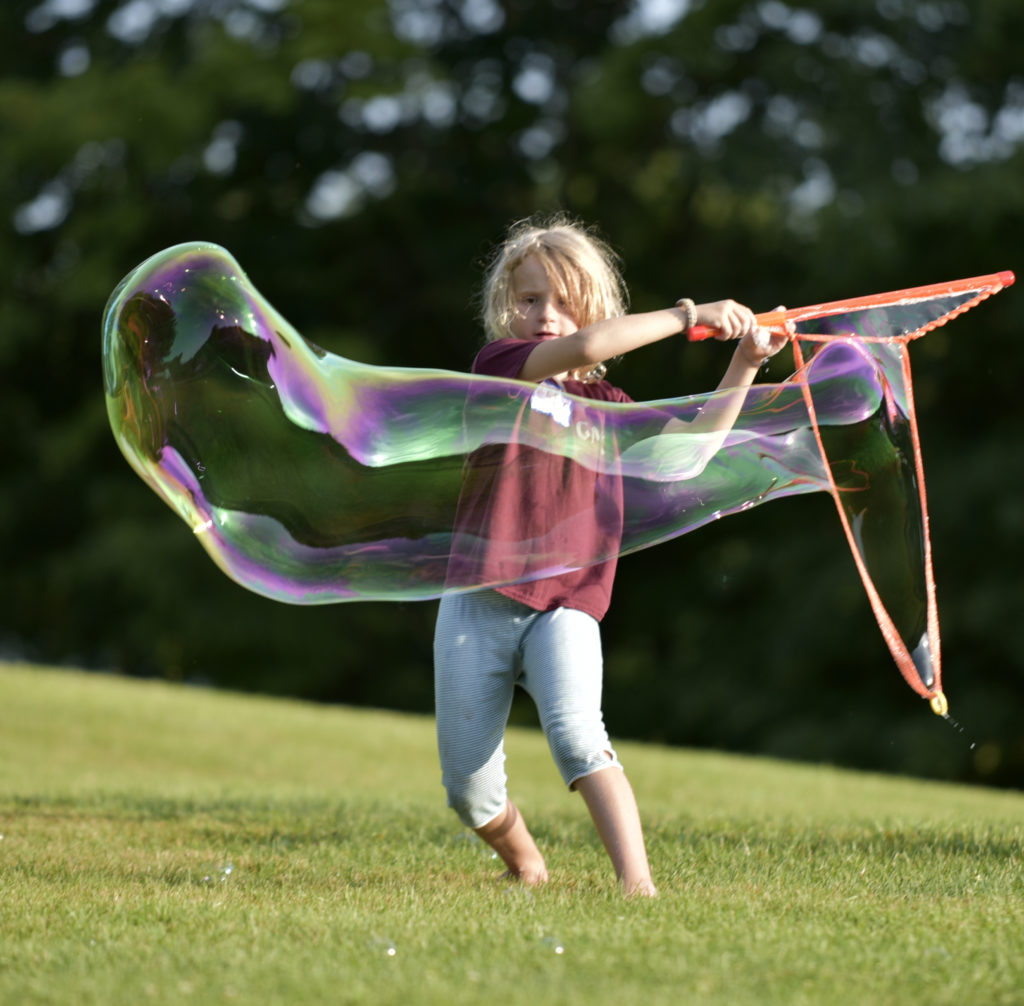 Making bubbles at Camp Common Ground